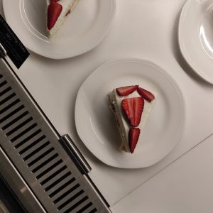 Strawberry shortcake slices are displayed on plates.